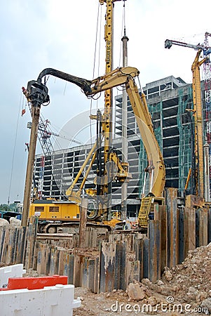 Steel sheet pile cofferdam machine at the construction site. Editorial Stock Photo